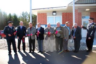 Many scissors make for small ribbons: Politicians and staff from L&A County seemed to admire the cut ribbon pieces at the opening of the $1.2 million Northbrook ambulance base last Friday.